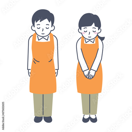 お辞儀をする男女　エプロン姿