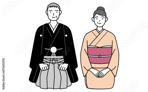 新年の挨拶をする着物姿のシニア夫婦