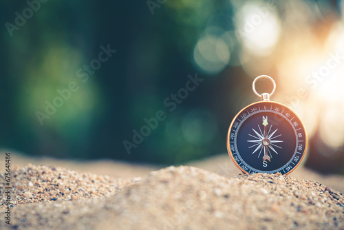 Travel of tourists with compass. compass of tourists on sandy beach. photo