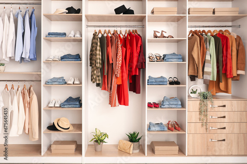 Stylish clothes, shoes and hats in boutique © Pixel-Shot
