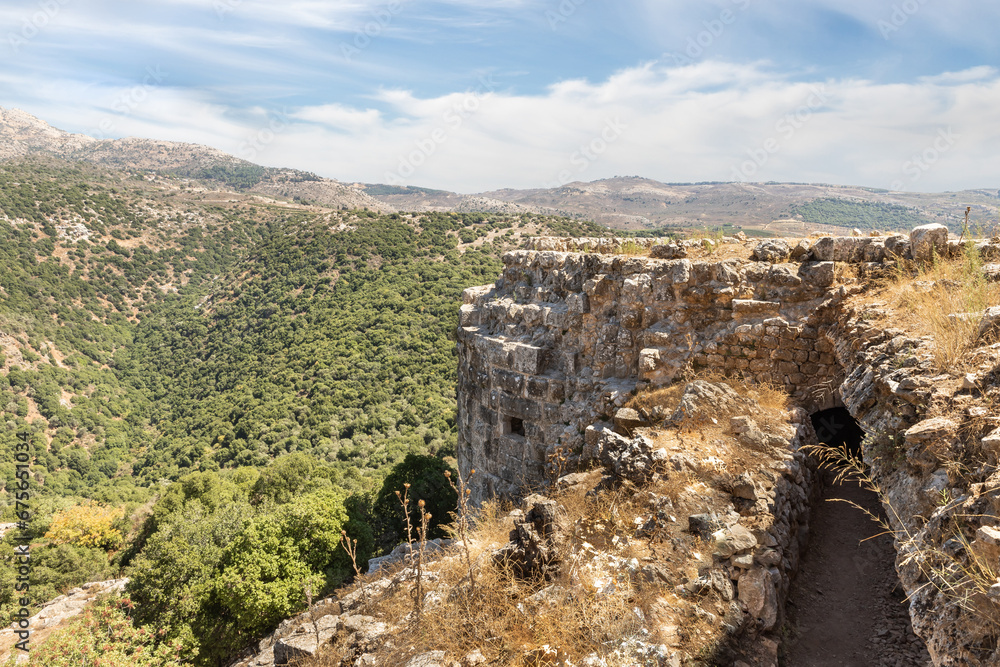 View  of the adjacent gorge from the round watchtower in the medieval fortress of Nimrod - Qalaat al-Subeiba, located near the border with Syria and Lebanon in the Golan Heights, in northern Israel