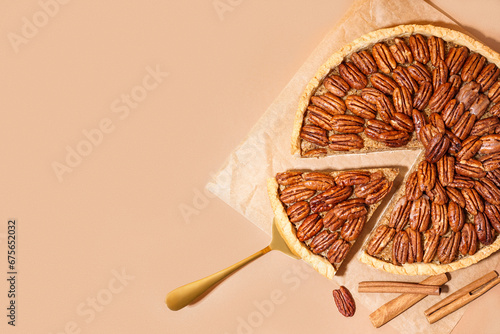Tasty pecan pie on orange background photo