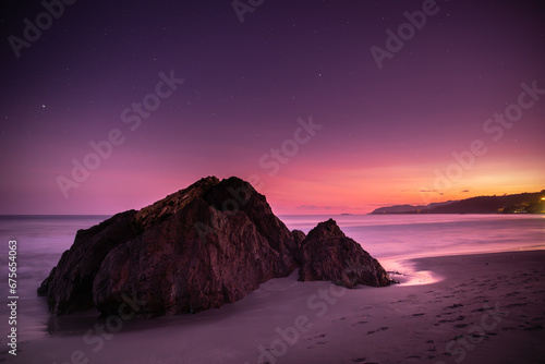 Magnificent seascape with colours of the just setting sun on the horizon and the falling night on the beach of Montezuma village in Costa Rica, Central America