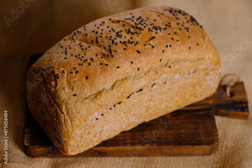 multi-grain whole wheat bread.. carbohydrates, high fiber, low calories. staple food. black sesame topping.