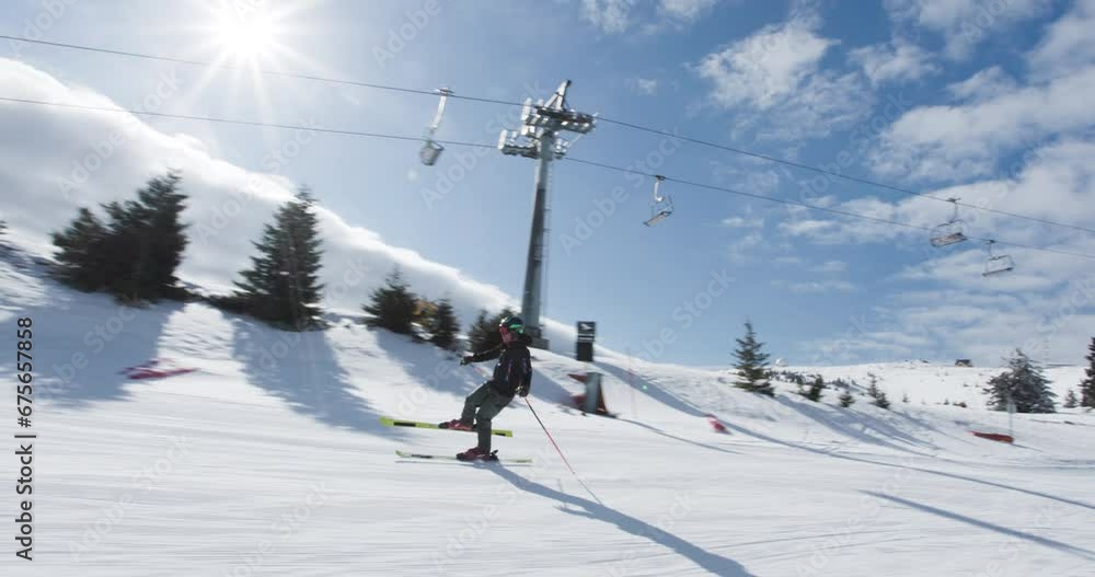 Advanced skier skiing on prepared slope. Professional fooling around skiing on one leg. Recorded at 50fps on cinema camera. Advanced skier skiing on prepared slope. Professional fooling around skiing on one leg. Recorded at 50fps on cinema camera.