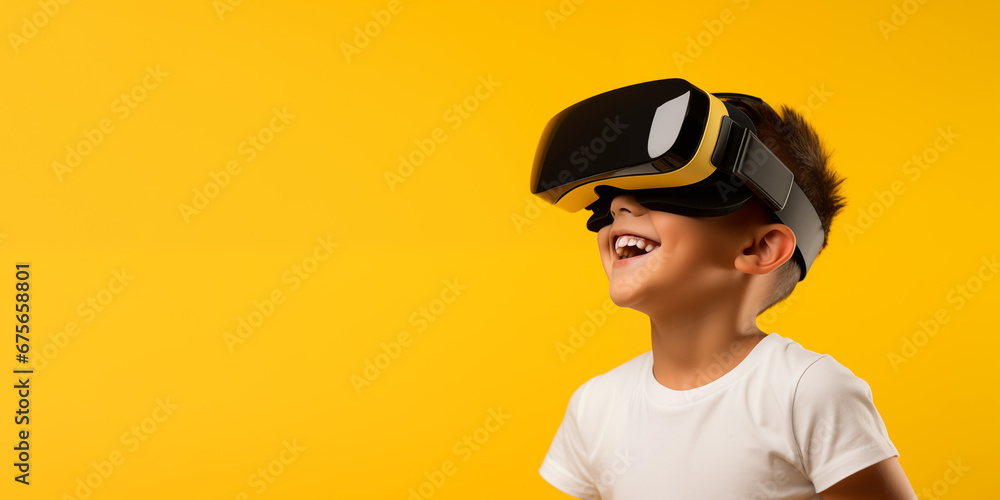 Young boy getting experience using VR headset glasses isolated on a yellow background with copy space Young boy getting experience using VR headset glasses isolated on a yellow background with copy space