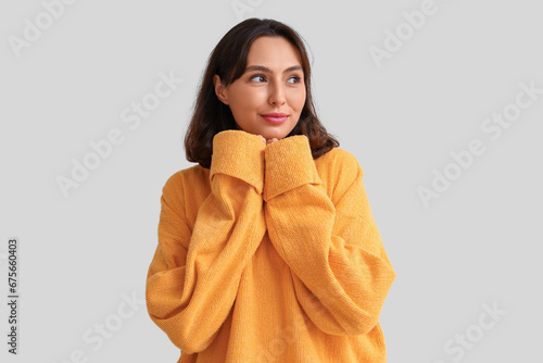 Young woman in yellow sweat...