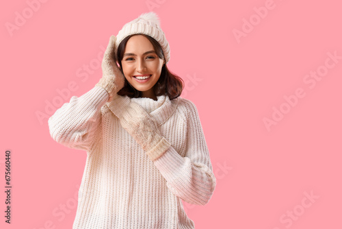 Young woman in warm clothes...