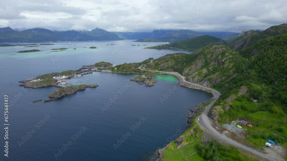 Aerial forwarding shot of Hamn on Senja Island during summer, cloudy day Aerial forwarding shot of Hamn on Senja Island during summer, cloudy day