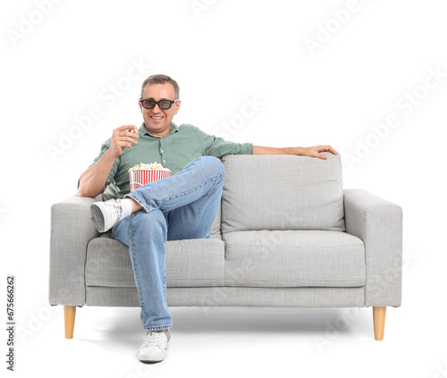 Mature man in 3D glasses wi...