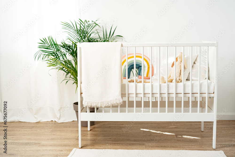 White wooden baby crib in nursery room - obrazy, fototapety, plakaty 
