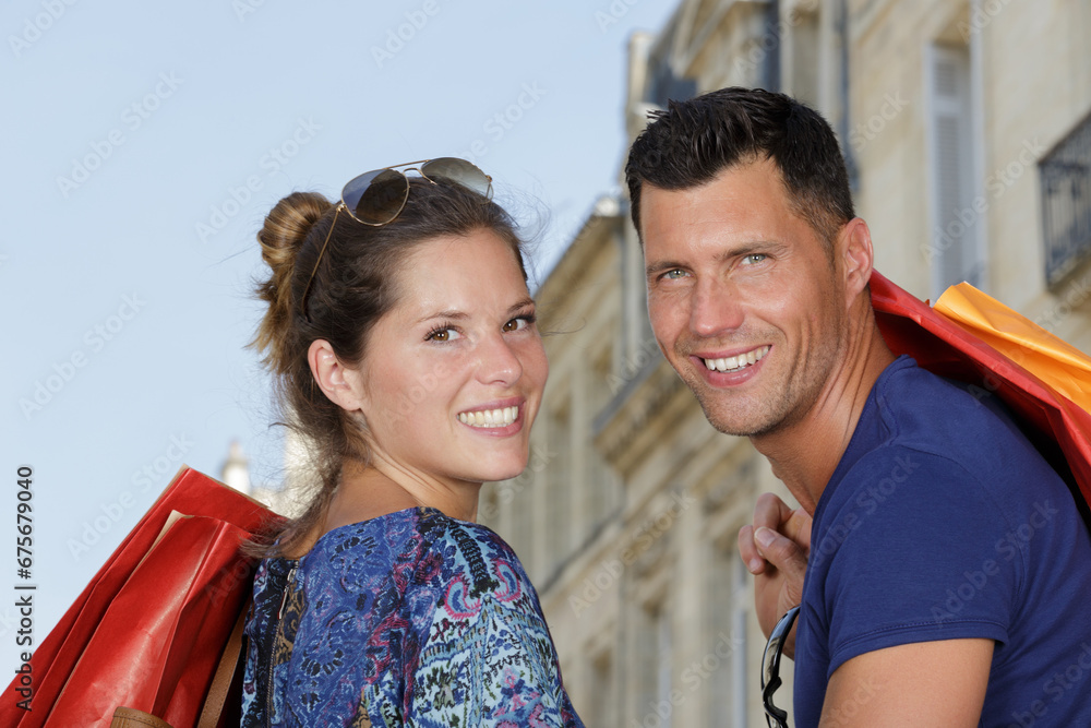 portrait of a couple with shopping bags