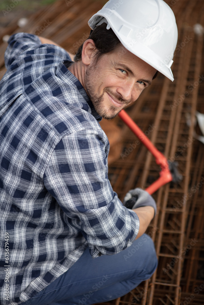 construction worker holdingpliers for foundation trays construction worker holdingpliers for foundation trays