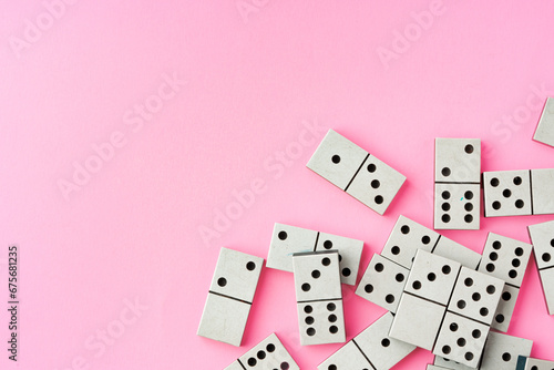 Domino tiles on pink background studio shot