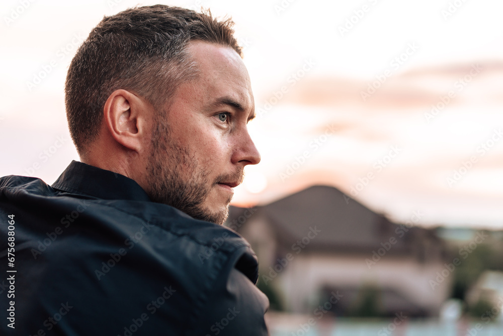 Fototapeta premium Portrait of handsome successful man standing outdoors