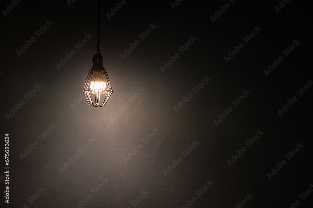 Light bulb warm light shade on dark background, concept of creativity and innovation. - obrazy, fototapety, plakaty 