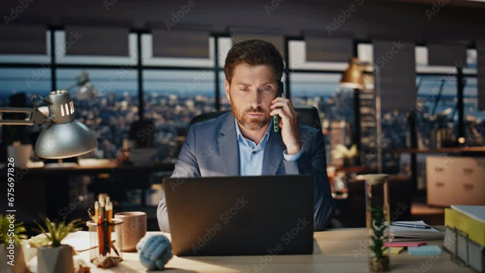 Confident boss calling phone evening view office closeup. Man talking smartphone Confident boss calling phone evening view office closeup. Man talking smartphone