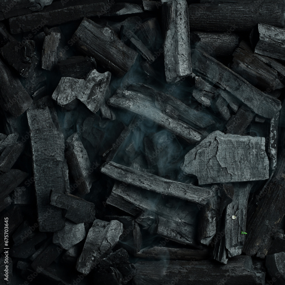 Black charcoal texture background. Close-up. Space for text.
