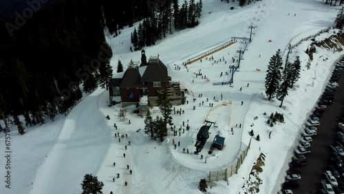 Ashland, Oregon, USA, Winter 2023.  Mt Ashland Ski Area.  Orbiting the Lodge with the learning area and the beginner ski lift. photo