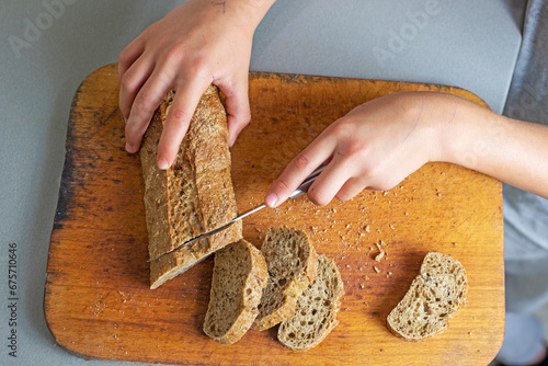 cut buckwheat bread on a cutting board in the kitchen. flatlay