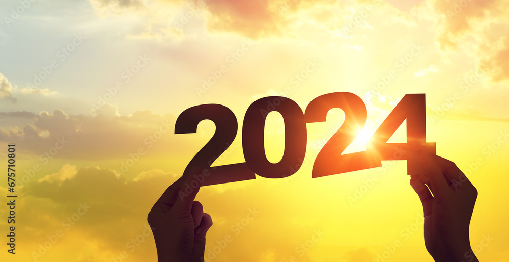 Silhouette hand holding 2024 year on sunset sky. Happy new year to plan and starting new life concept. Silhouette hand holding 2024 year on sunset sky. Happy new year to plan and starting new life concept.