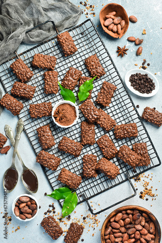 Group of chocolate cookies, also a traditional Argentinean sweet, with nuts. Top view. On a gray stone background. Space for text.