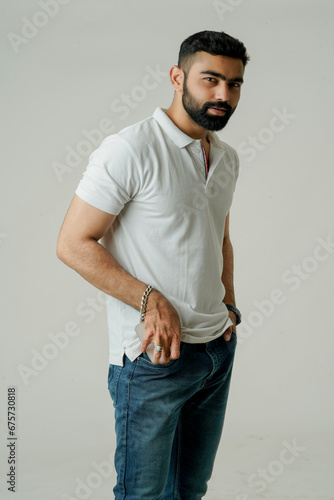 A man in a t-shirt looks relaxed and casual, with short sleeves and a comfortable fit.