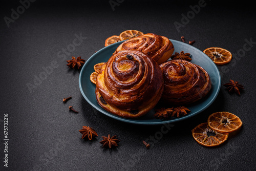 Delicious baked cinnamon raisin rolls in the form of rolls