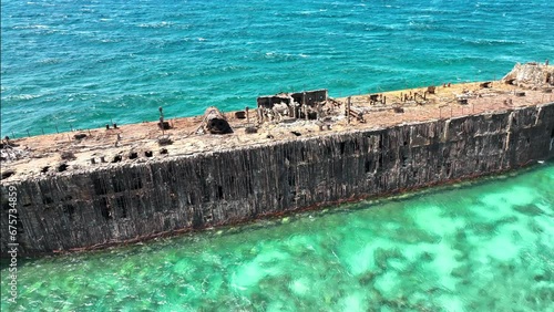 Rusty Shipwreck. Crystal clear waters off of Lanai, Hawaii. Beached large ship. photo