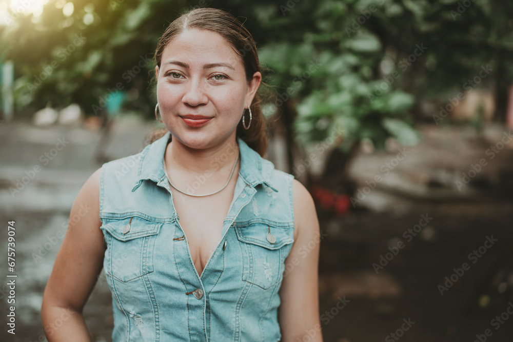 Portrait of Latin American girl face looking and smiling at the camera. Portrait of young Nicaraguan woman smiling at camera. Portrait of attractive latin girl smiling outdoors Portrait of Latin American girl face looking and smiling at the camera. Portrait of young Nicaraguan woman smiling at camera. Portrait of attractive latin girl smiling outdoors