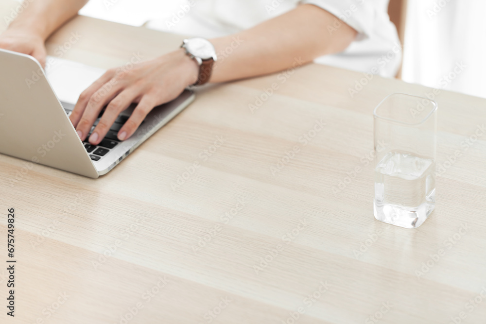 person working on laptop at desk person working on laptop at desk
