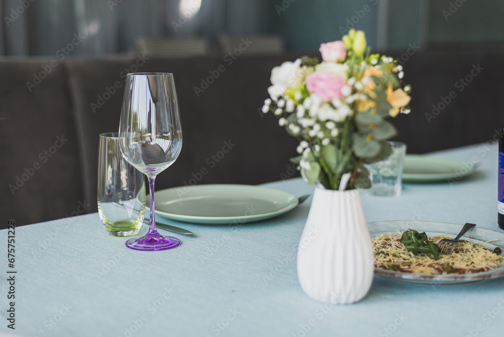 Beautiful flowers decorated on the table.Tables set for an event party or wedding reception. Beautiful flowers decorated on the table.Tables set for an event party or wedding reception.