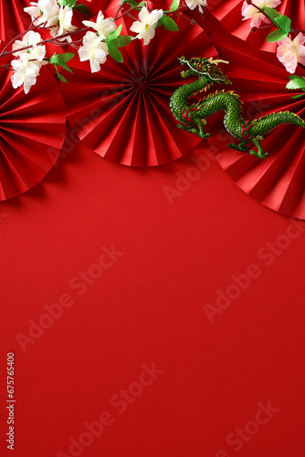 2024 Chinese New Year Poster: Dragon, Sakura, and Folding Fans on Red Background