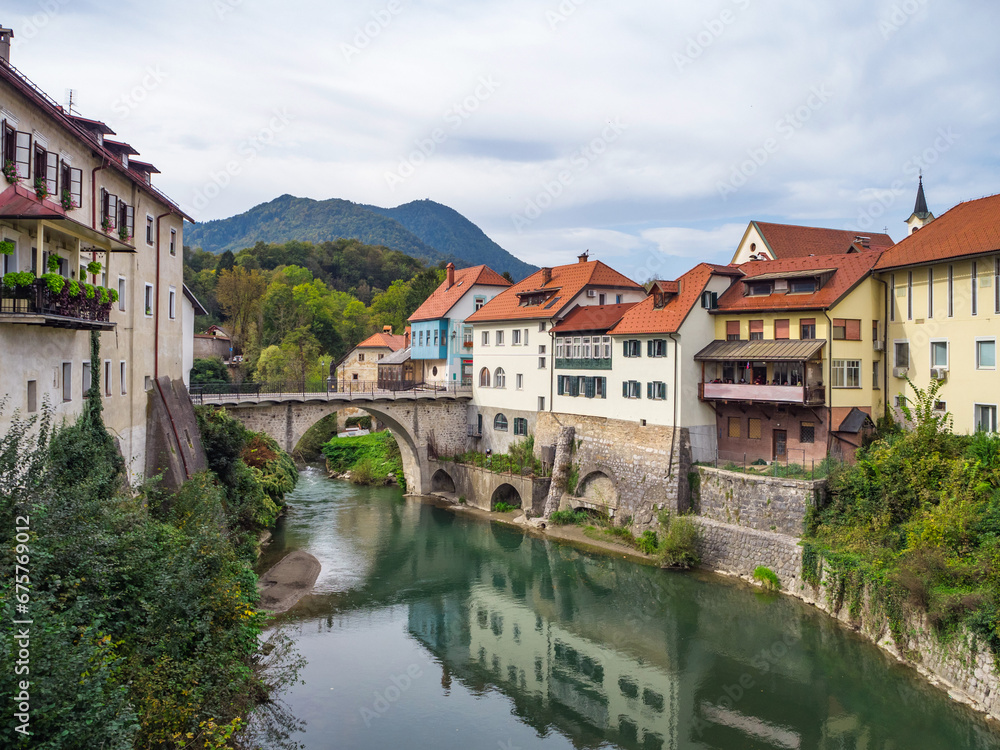 City of Skofja Loka, Slovenia with view of the Capuchin Bridge over the Selska Sora River in the old city center