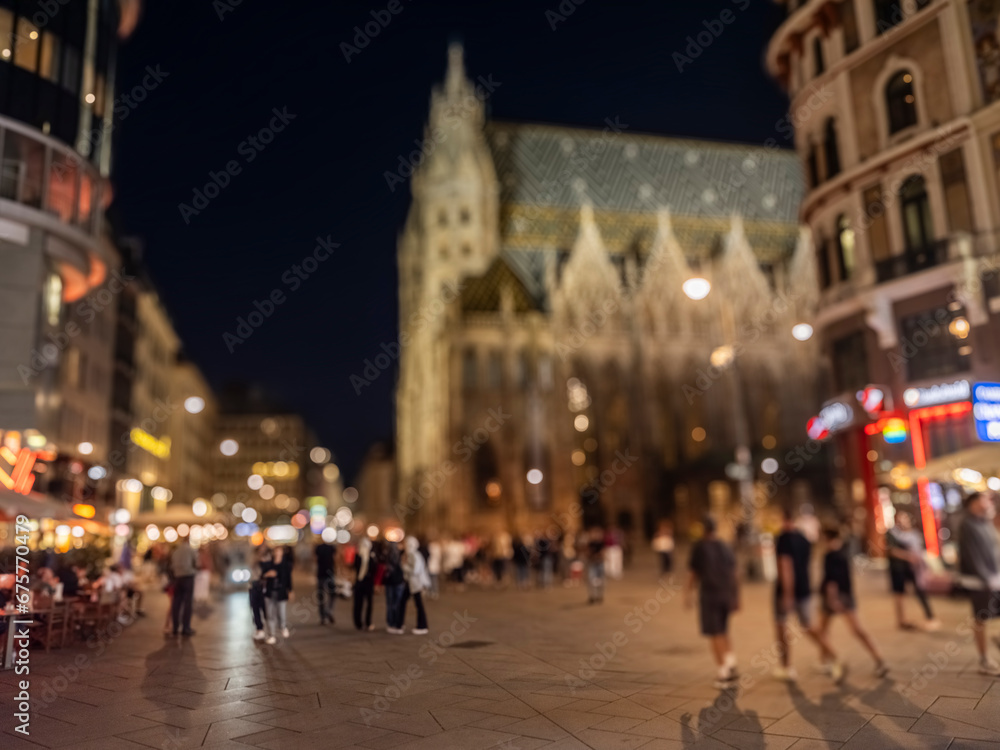 Crowd of anonymous people walking on busy city street at night , urban city life background