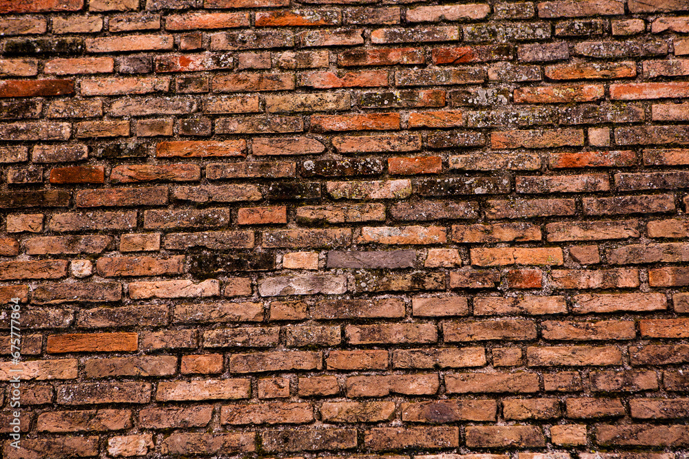 Fototapeta premium Photo of an old empty brick background for design. A red brick wall.