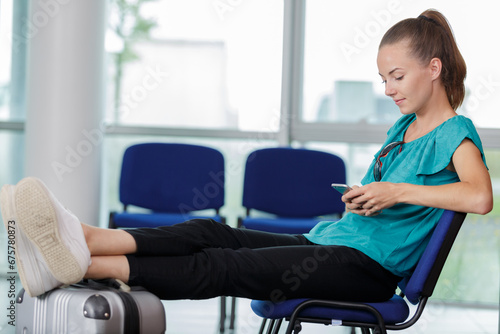 young woman waiting on an airport