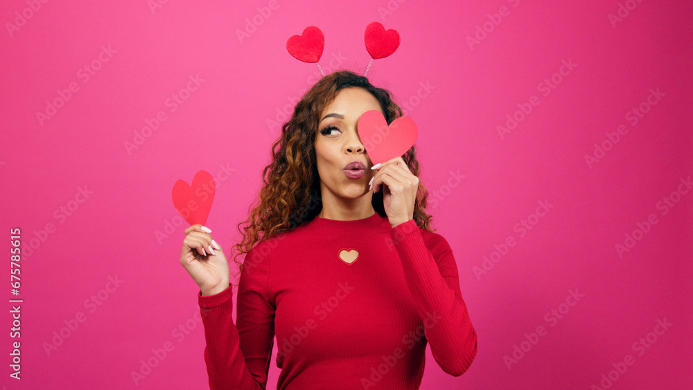 Cute multi-ethnic woman poses with paper hearts, symbol of love studio Valentine Cute multi-ethnic woman poses with paper hearts, symbol of love studio Valentine