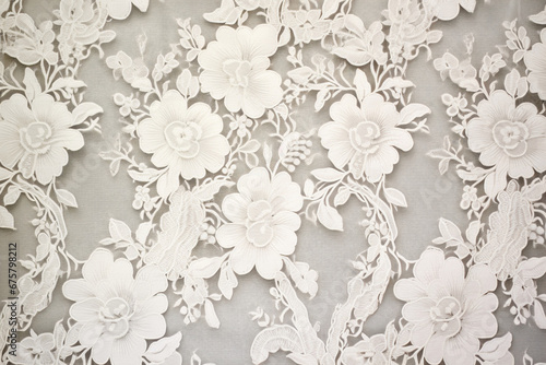 Intricate lace fabric texture with delicate floral patterns