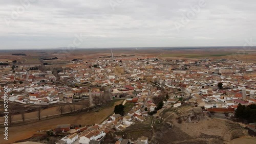 Church and little village in Spain. Drone footage in Castilla la Mancha, land of don quijote, vineyards, flat land, cereals, dirt tracks and paths. Horcajo de Santiago in 4K with DJI Mini 2 photo
