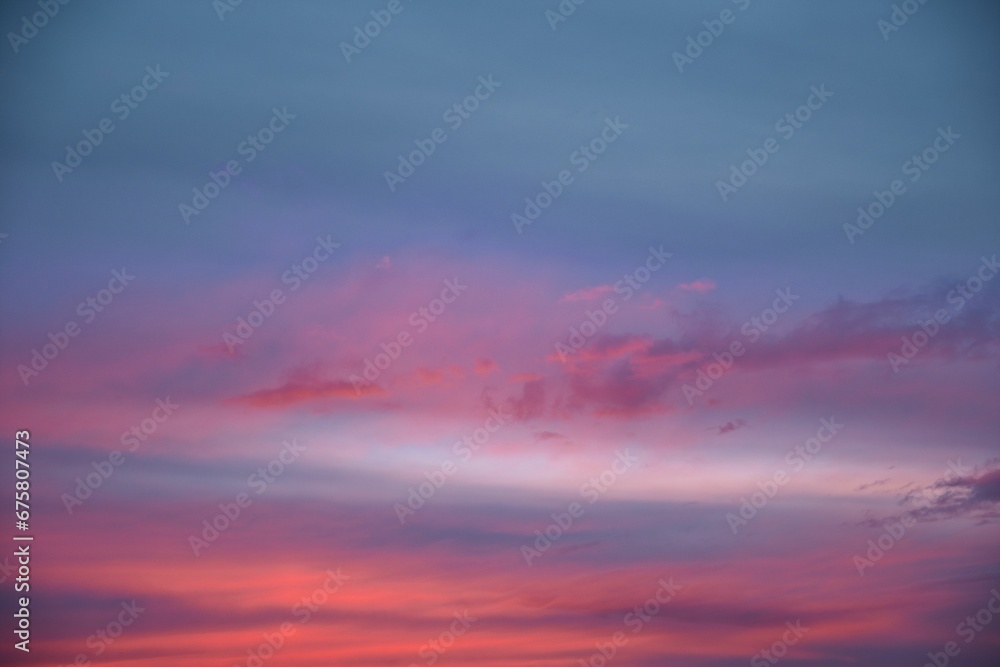 Stunning blue, purple and pink sunset sky  background