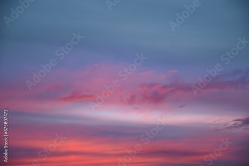 Stunning blue, purple and pink sunset sky  background © Wirestock