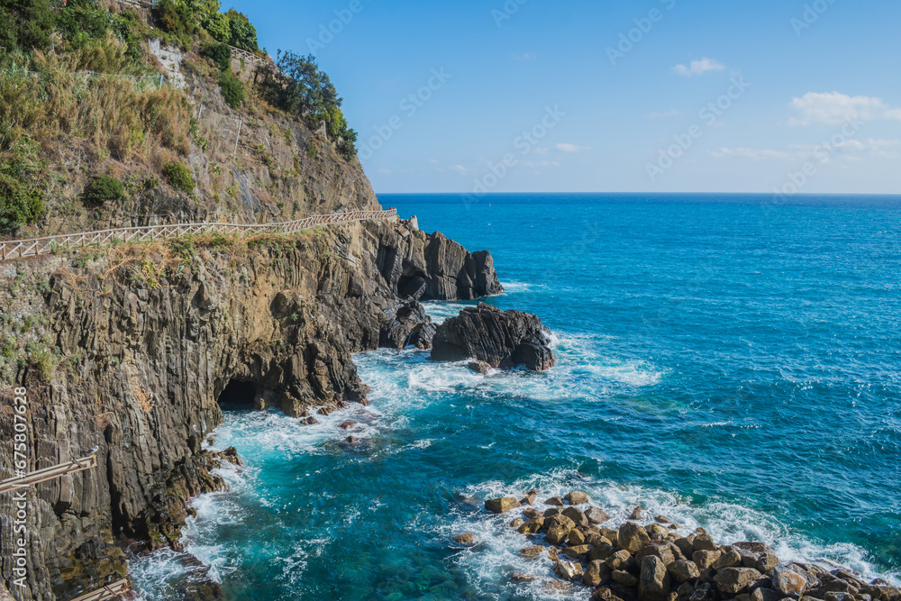 Fototapeta premium Pathway with mountain fence next to the Mediterranean Sea, Riomaggiore ITALY