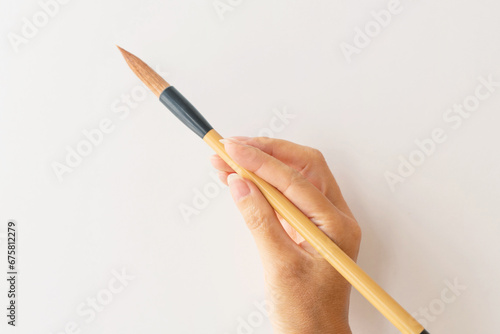 筆を持つ手