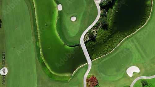 Top down shot of picturesque golf course with vast diversity of lengths for demanding club members. Steep elevation changes and dramatic vistas for enjoyable leisure time photo