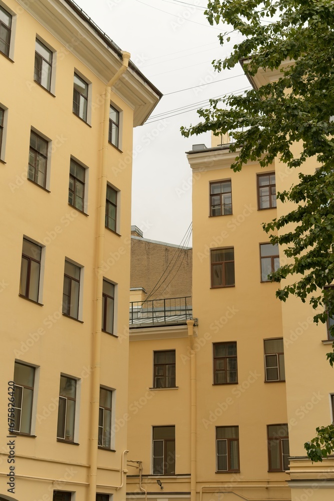 Fototapeta premium St. Petersburg, Russia, October 28, 2023. Fragment of the facade of a residential building in the constructivist style. 