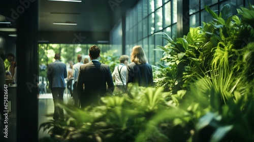 Green office walls with plants. Employee wellness and nature friendly corporate environment with modern, sustainable and ecological office space. ESG standards for responsible business.