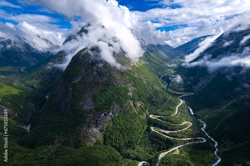 Aerial view from above the clouds  the valley of Videseter descending towards fjord in Norway photo