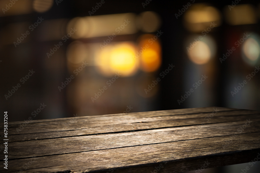 Empty wooden background for your display space. Blurred bokeh background of cafe window reflections of holiday lanterns with empty wooden tabletop for your product Empty wooden background for your display space. Blurred bokeh background of cafe window reflections of holiday lanterns with empty wooden tabletop for your product