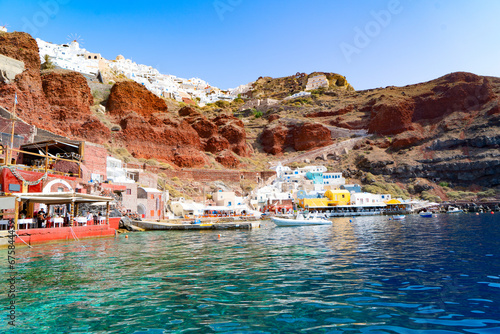 Amoudi bay with brilliant water and boats, port of Oia, Santorini Greece at sunny summer
